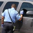 Police Officer Checks Child in Car